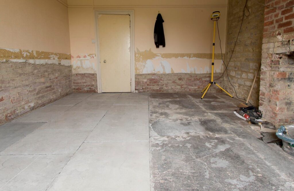 Flagstone floor relaying and restoration work in progress inside period property