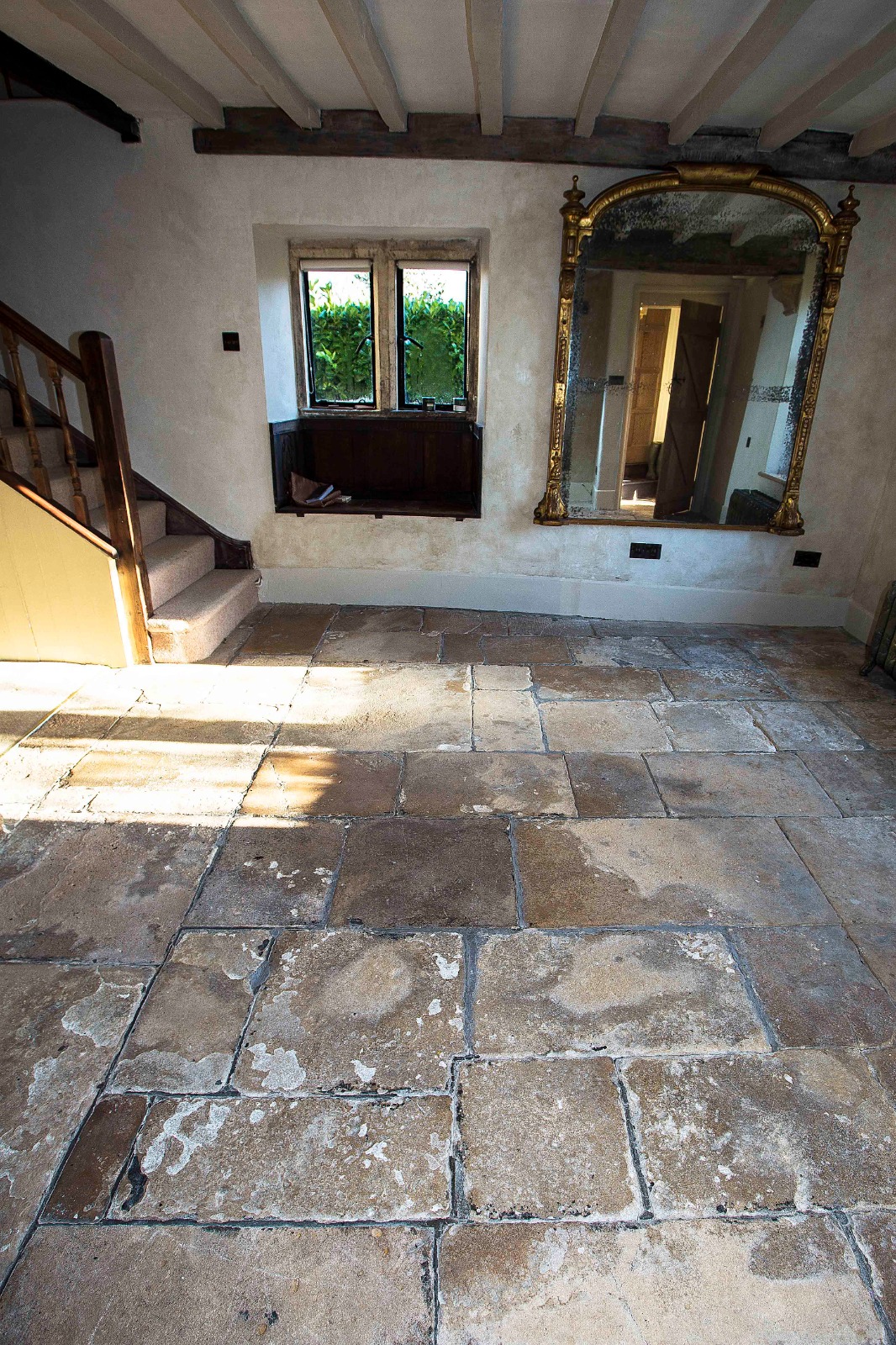 Unrestored flagstone floor before professional restoration