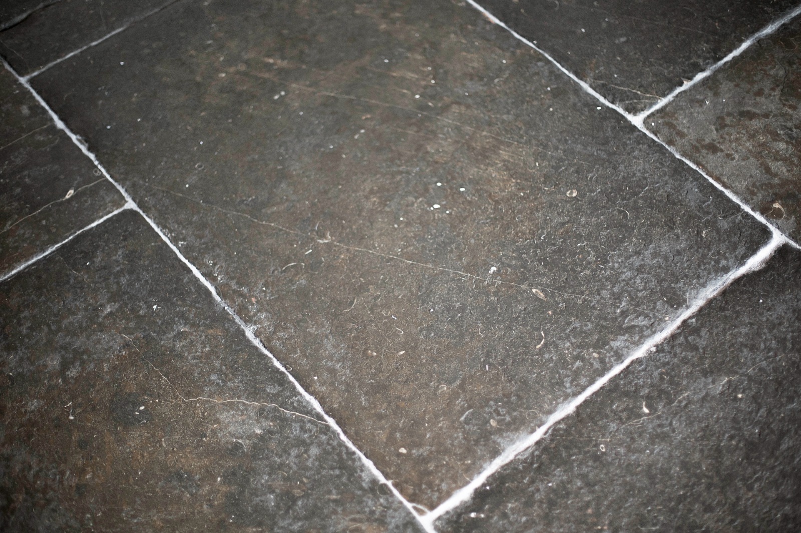 Close-up of lime pointing during flagstone floor restoration